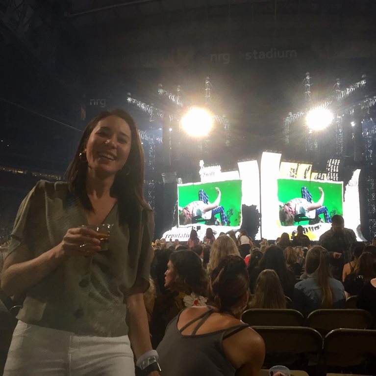 Mim at a concert with big tv screen